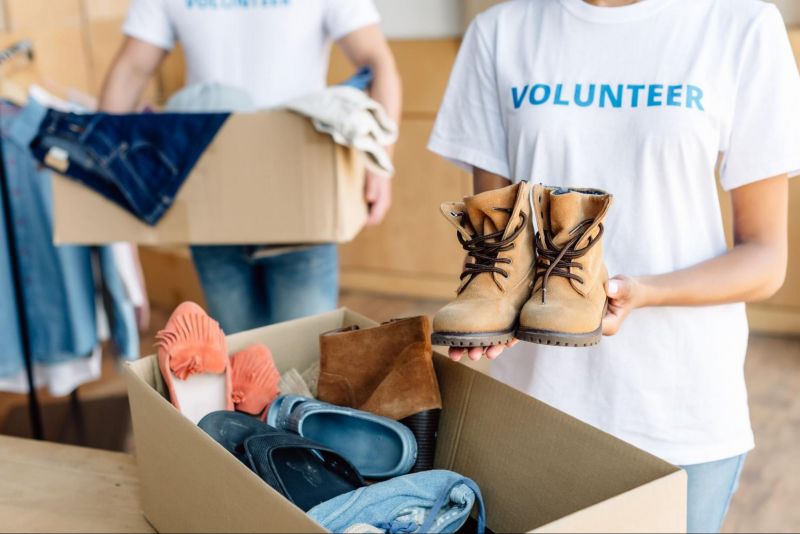 Handing over shoes for homeless donations