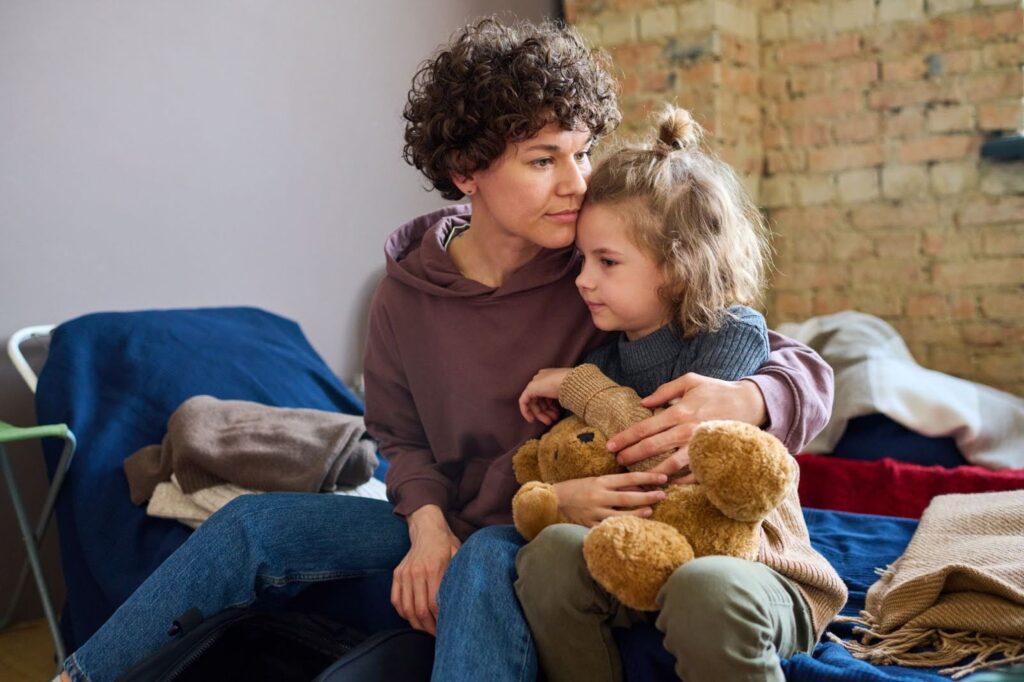 Young woman and son receiving support through essential donations